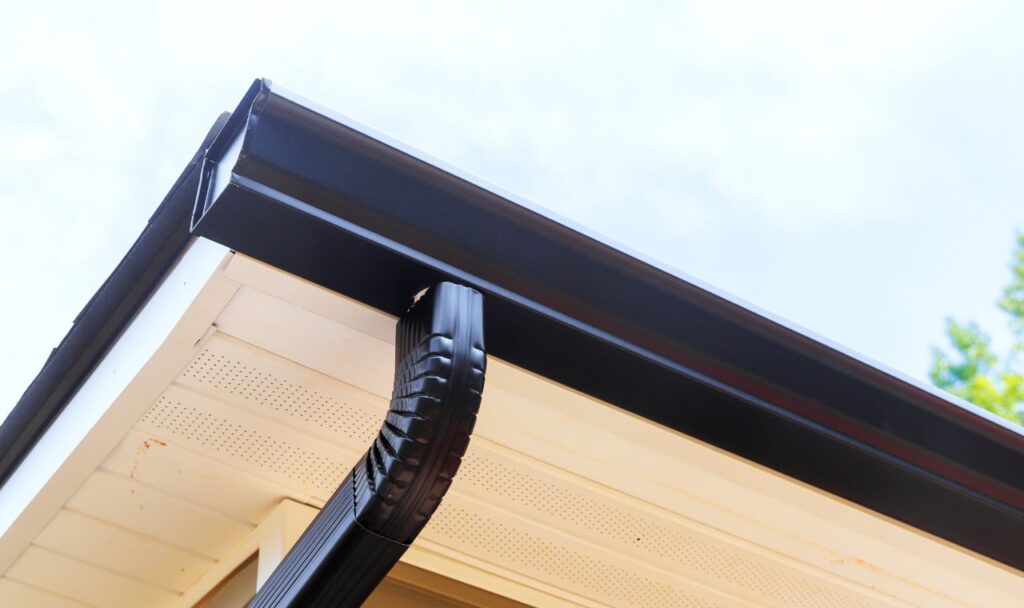 Pressure washed gutter end cap of a home.