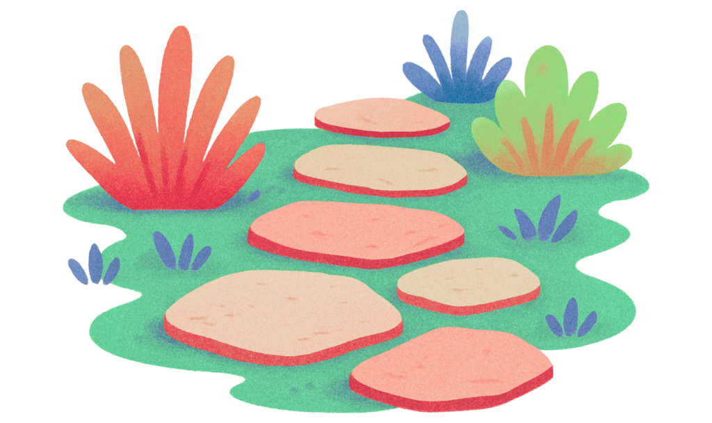 Newly pressure washed cobblestone walkway with plants on the side.