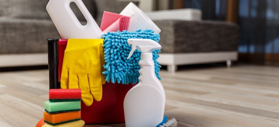 Some of our cleaning equipment and solutions in a bucket.